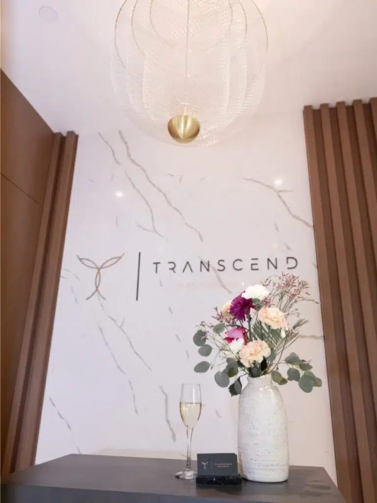 Luxury Transcend Cosmetic Dentistry lobby in Vancouver featuring modern décor, elegant seating, fresh flowers, and a welcoming, spa-like atmosphere.